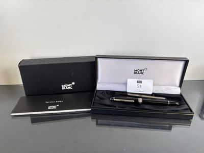 a box with a pen in it and a pen in it