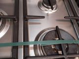 a close up of a gas stove with two burners