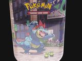 a jar with a pokemon trading card game inside of it