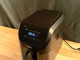 an image of a coffee maker on a wooden table
