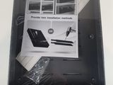 someone is holding up a box with a picture of a laptop on it