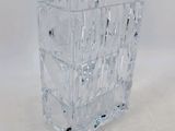 a glass vase that has a lot of glass inside of it