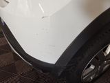 a close up of a white car with a black rim