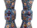 two vases that have been decorated with flowers on them