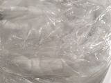 a large plastic bag wrapped around a toilet in a room