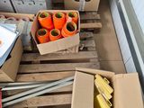 many boxes of orange tape sitting on a pallet