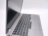 a close up of a laptop computer on a white surface