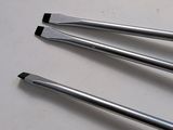 three tools that are sitting on a table