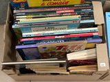 a box full of books sitting on the floor