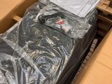 a box with a black shirt in it sitting on a pallet