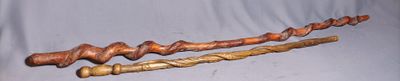 three different types of wooden canes on a blue background