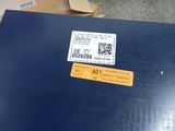a laptop computer sitting on top of a blue table