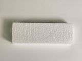a close up of a piece of paper on a white surface