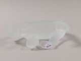 a glass elephant that is sitting on a white surface