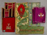 several pieces of cloth are laid out on a gray surface