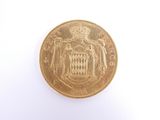 an image of a gold coin on a white surface