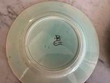 a white plate with a blue and black design on it