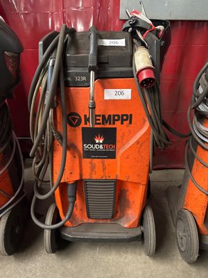 two welding machines sitting next to each other on the floor