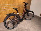 a bike that is parked in front of a wall