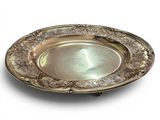 a silver plate on a white background with a white background
