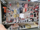 many different tools on the shelves in the store