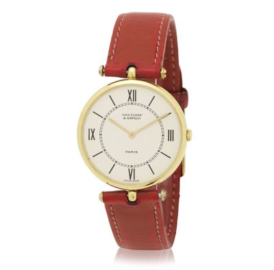 a close up of a wrist watch with roman numerals on it