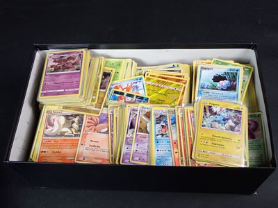 a box full of pokemon cards sitting on a table