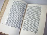 an open book that is sitting on a table