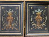 pair of black and gold painted cabinet doors with a horse and flower design