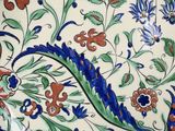 a decorative plate with flowers on it on a table