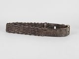 a close up of a belt with a metal buckle on it
