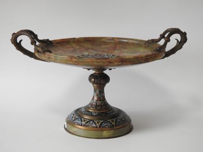 an image of a bronze bowl with handles on a pedestal