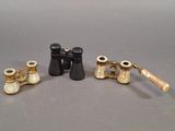 three different types of binoculars are shown on a gray surface