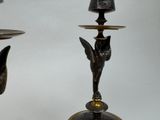 two candles that are sitting on a table