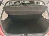 a trunk of a car with the back seat folded open