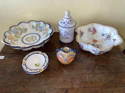 a wooden table topped with bowls and bowls on it