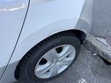 a white car parked on the side of the street