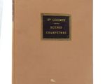 an old book with a gold cover and black lettering on it