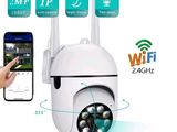 an image of a person holding a smart phone and a wireless camera