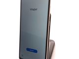the back of a phone with a display on it sitting on top of a stand