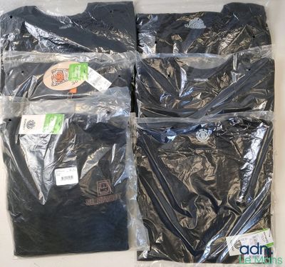 three pairs of black t - shirts in plastic bags on a table