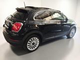 the back end of a black fiat suv parked in a white room
