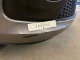 a close up of the front bumper of a car with a sticker on it