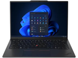 l'ordinateur portable est ouvert sur une surface blanche avec un fond bleu