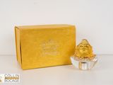 a gold box with a small buddha figurine in it