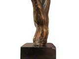 bronze sculpture of a hand holding a trumpet on a black marble base
