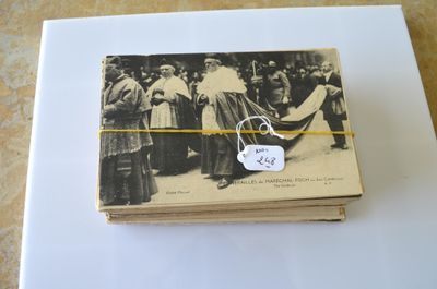 an old photo of a couple of people standing next to each other on a table