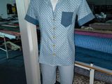 a mannequin with a shirt and shorts on display in a room