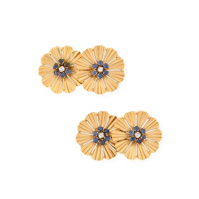 two pairs of gold tone flower earrings with blue stones