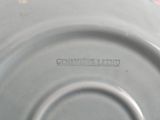 a close up of a plate with a name on it